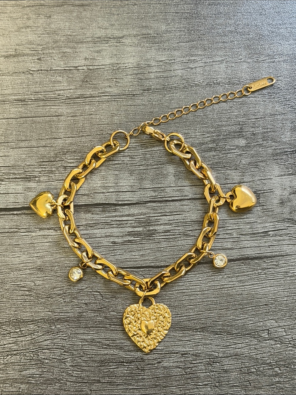 Gold plated stainless steel heart and rhinestone charm bracelet